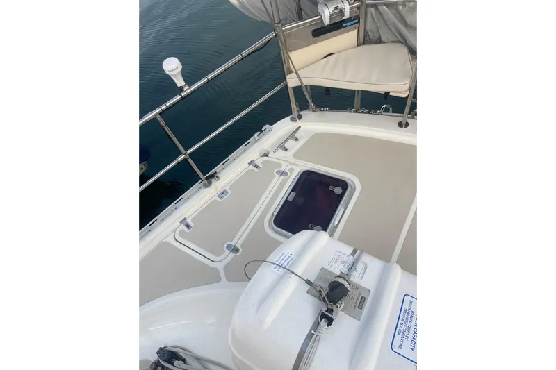 Peetee Hana Yacht Photos Pics 2008 Caliber center cockpit cutter deck with seating and safety equipment.