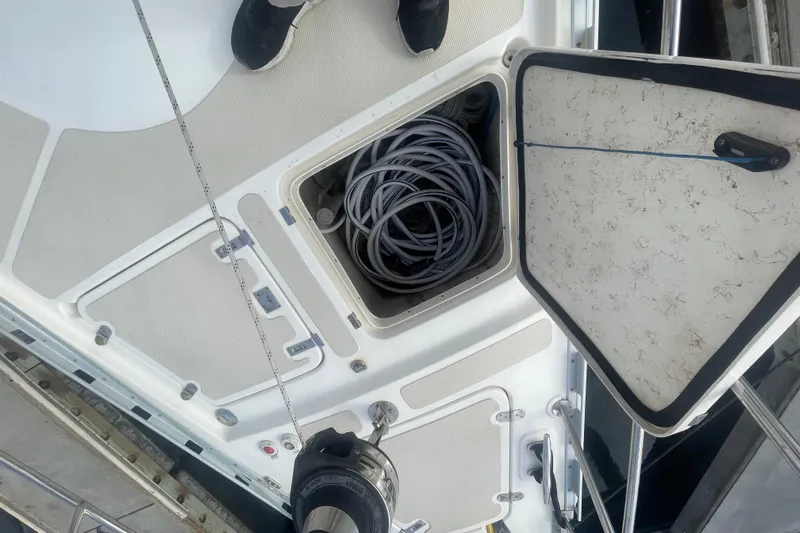 Peetee Hana Yacht Photos Pics Open hatch on 2008 Caliber center cockpit cutter, revealing coiled rope storage.