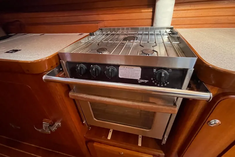 Peetee Hana Yacht Photos Pics Galley stove in 2008 Caliber center cockpit cutter sailboat kitchen.