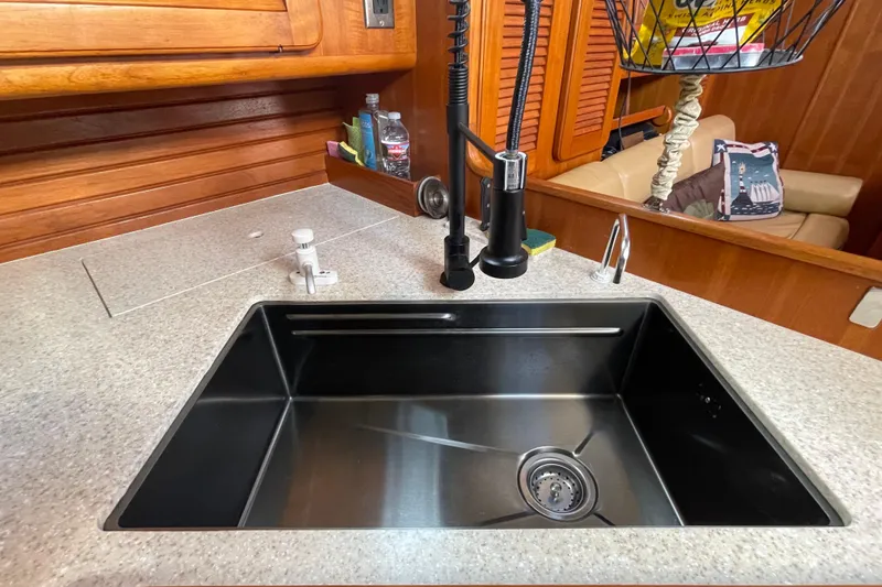 Peetee Hana Yacht Photos Pics 2008 Caliber center cockpit cutter galley with stainless steel sink and modern faucet.