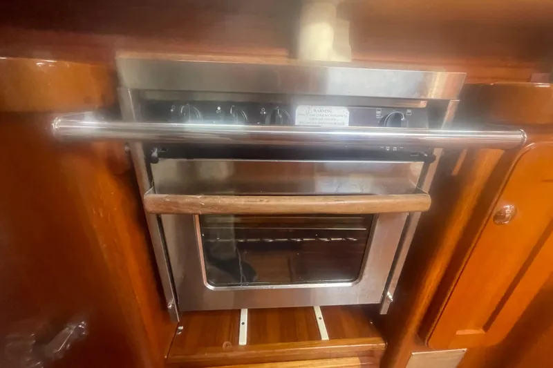 Peetee Hana Yacht Photos Pics Stainless steel oven in 2008 Caliber center cockpit cutter yacht kitchen.