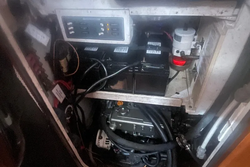 Peetee Hana Yacht Photos Pics Engine compartment of a 2008 Caliber center cockpit cutter with visible wiring and components.