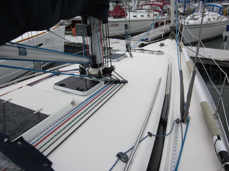 Sailboat deck of a 1991 Canadian Sailcraft 40, featuring rigging and hatches.