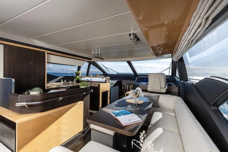 Ombretta V Yacht Photos Pics Luxurious interior of 2016 Azimut 66 yacht with elegant seating and panoramic windows.