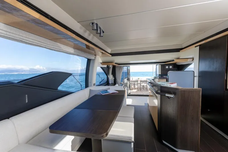 Ombretta V Yacht Photos Pics Luxurious interior of 2016 Azimut 66 yacht with ocean view and modern furnishings.