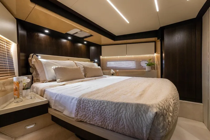 Ombretta V Yacht Photos Pics Luxurious bedroom interior of 2016 Azimut 66 yacht with modern design and ambient lighting.