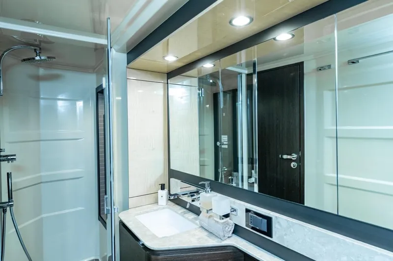 Ombretta V Yacht Photos Pics Luxurious bathroom interior of 2016 Azimut 66 yacht with modern fixtures and elegant design.