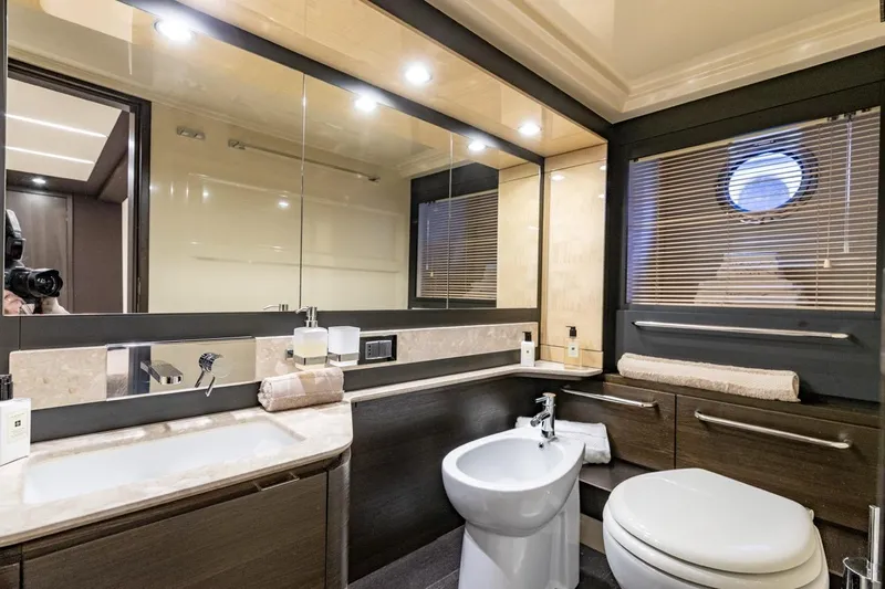Ombretta V Yacht Photos Pics Luxurious bathroom interior of 2016 Azimut 66 yacht with modern fixtures and elegant design.