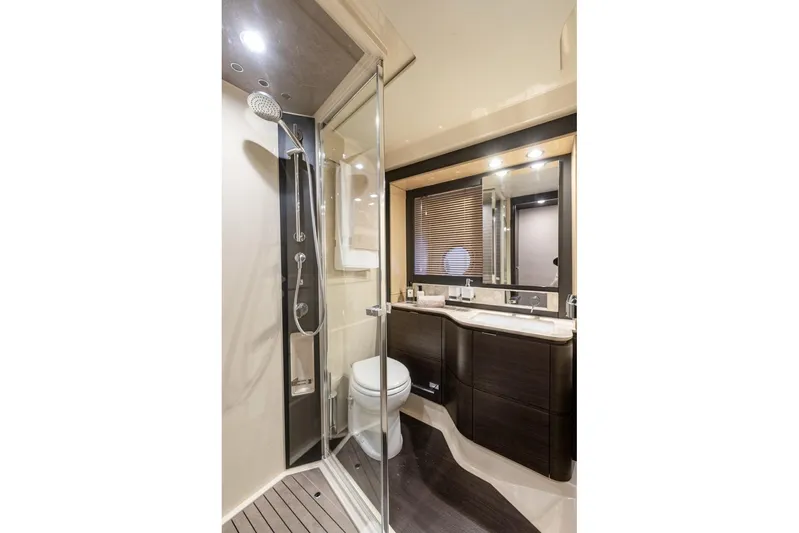 Ombretta V Yacht Photos Pics Luxurious bathroom in 2016 Azimut 66 yacht with modern fixtures and elegant design.