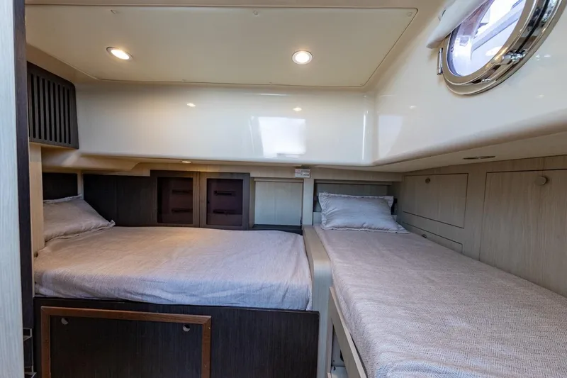 Ombretta V Yacht Photos Pics Interior cabin of 2016 Azimut 66 yacht with twin beds and modern design.
