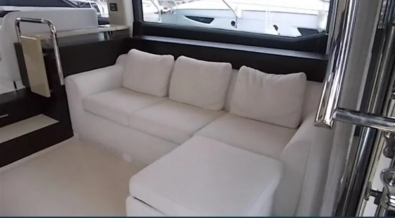 Ombretta Yacht Photos Pics Luxurious white sofa in 2017 Azimut 66 yacht interior.