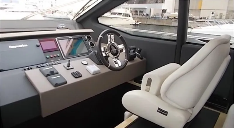 Ombretta Yacht Photos Pics Helm of 2017 Azimut 66 yacht with modern controls and luxurious seating.