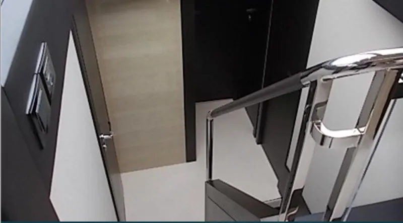 Ombretta Yacht Photos Pics Staircase inside 2017 Azimut 66 yacht, featuring sleek modern design and chrome railing.