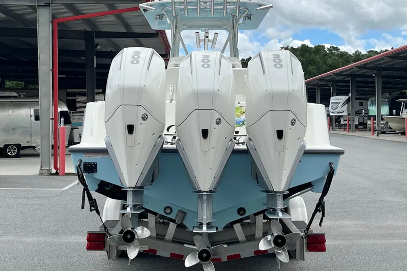  Yacht Photos Pics 2021 SeaVee 340Z boat with triple outboard engines in a storage facility.