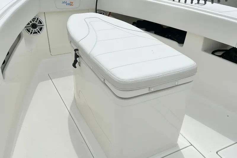  Yacht Photos Pics 2021 SeaVee 340Z boat interior with cushioned seating and storage compartment.