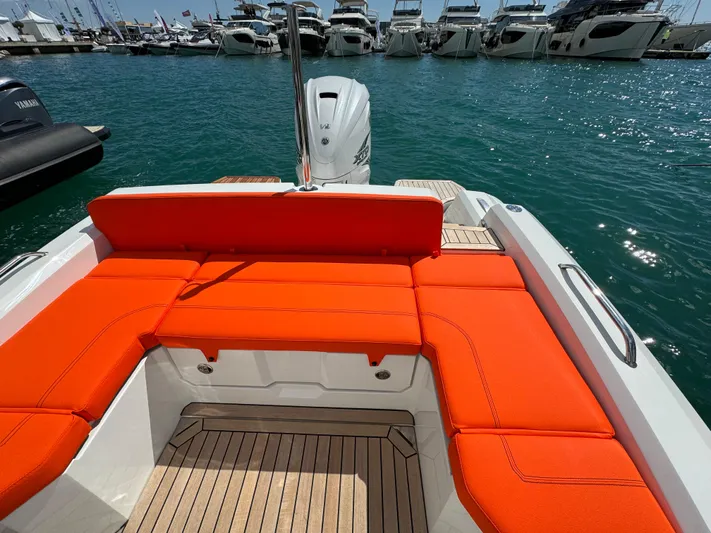  Yacht Photos Pics SuperRib Open 27 boat 2025 model with orange seating, docked at marina.