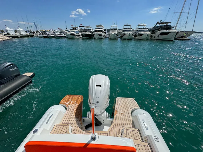  Yacht Photos Pics SuperRib Open 27 (2025) boat docked in a marina with other yachts.