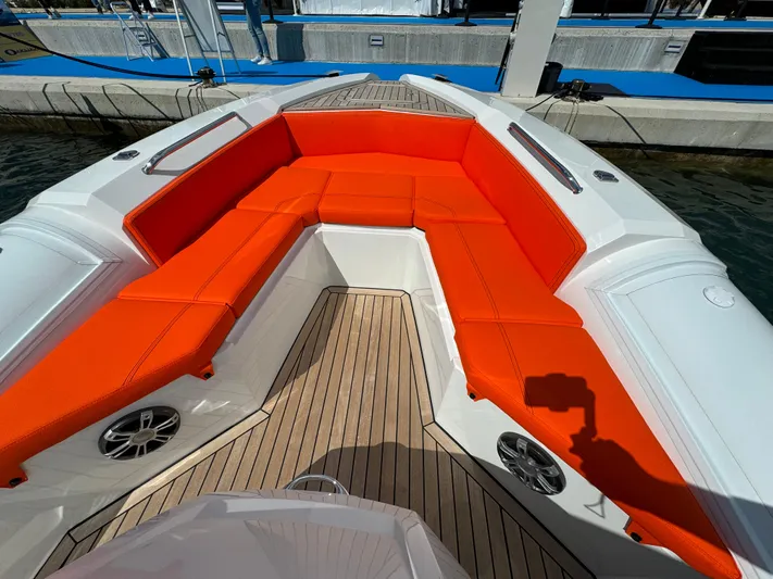 Yacht Photos Pics SuperRib Open 27 (2025) boat with orange seating and wooden deck.