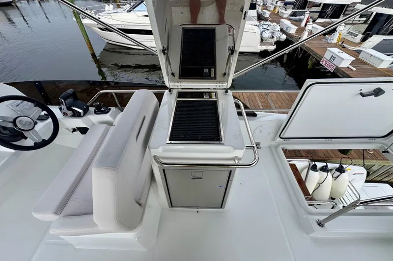 Yacht Photos Pics 2026 Beneteau Antares 12 yacht deck with grill and seating area.