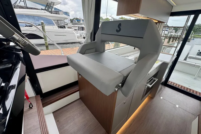  Yacht Photos Pics Interior of 2026 Beneteau Antares 12 yacht, featuring modern helm seat and sleek design.