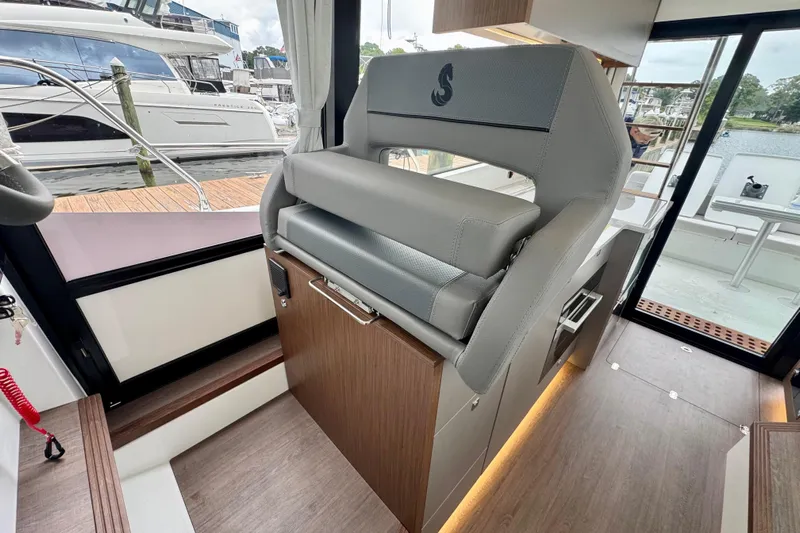  Yacht Photos Pics 2026 Beneteau Antares 12 interior with modern seating and sleek design.