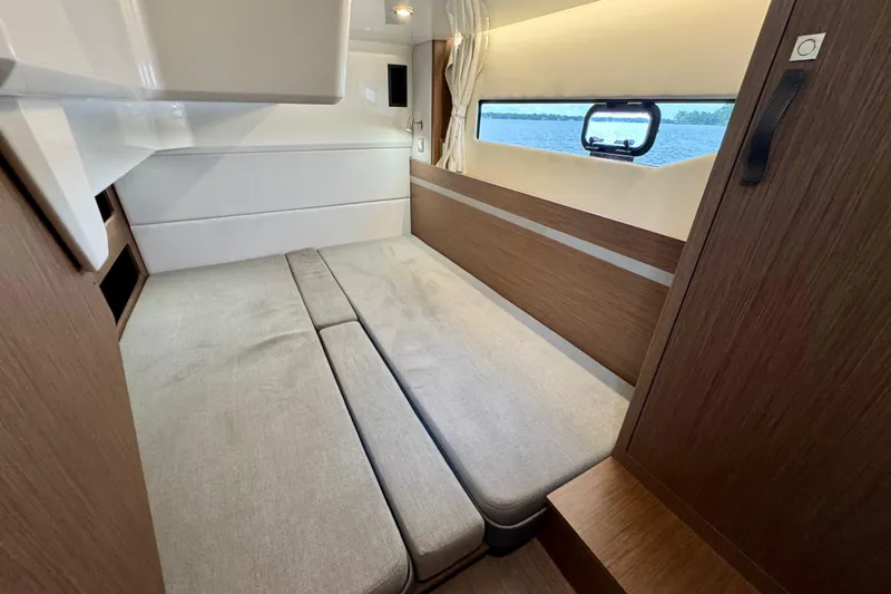  Yacht Photos Pics Interior cabin of 2026 Beneteau Antares 12 with modern design and comfortable seating.