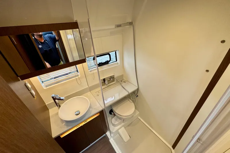  Yacht Photos Pics Bathroom interior of 2026 Beneteau Antares 12 yacht, featuring modern fixtures and compact design.