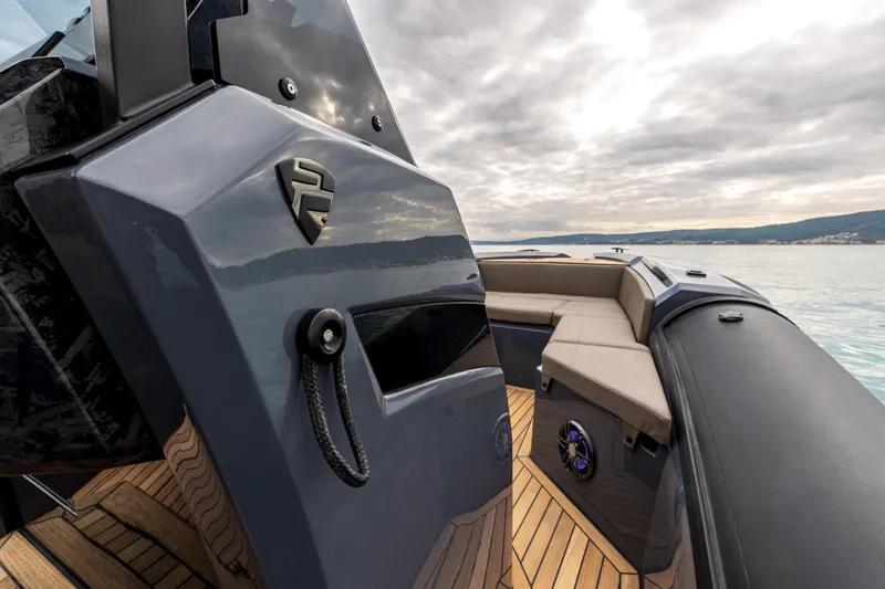  Yacht Photos Pics 2026 SuperRib Open 27 boat with sleek design, luxury seating, and modern features on calm water.