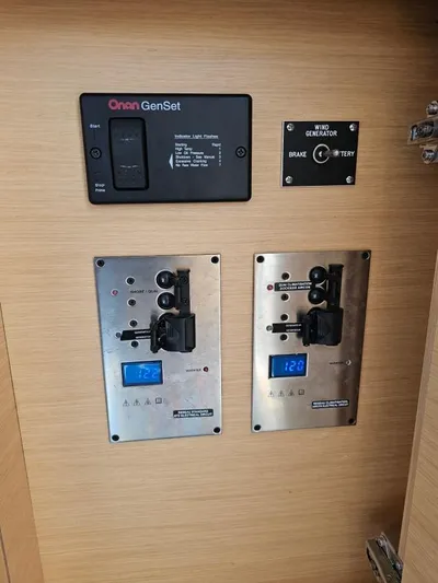Moondance Yacht Photos Pics Electrical control panel on a 2008 Lagoon 420 yacht, featuring Onan GenSet and voltage displays.