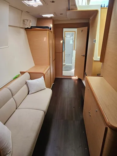 Moondance Yacht Photos Pics Interior of 2008 Lagoon 420 yacht with modern wood finish and cozy seating area.