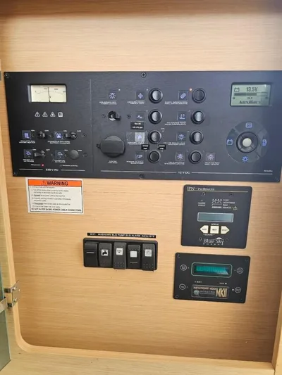 Moondance Yacht Photos Pics Control panel of a 2008 Lagoon 420 yacht with various switches and displays.