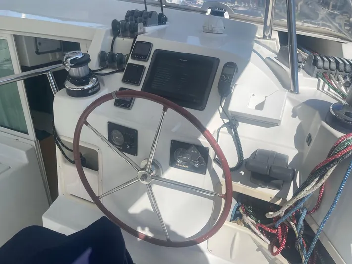 Moondance Yacht Photos Pics Steering wheel and controls of a 2008 Lagoon 420 yacht.