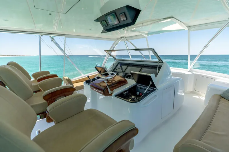 Gas Money Yacht Photos Pics Luxurious helm of 2015 Viking 62 Convertible yacht with ocean view.