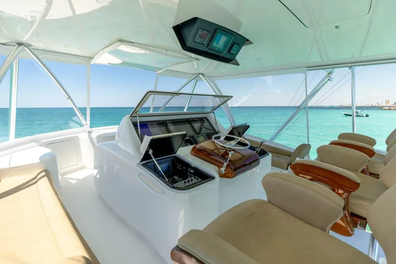 Gas Money Yacht Photos Pics Luxurious interior of 2015 Viking 62 Convertible yacht with ocean view.