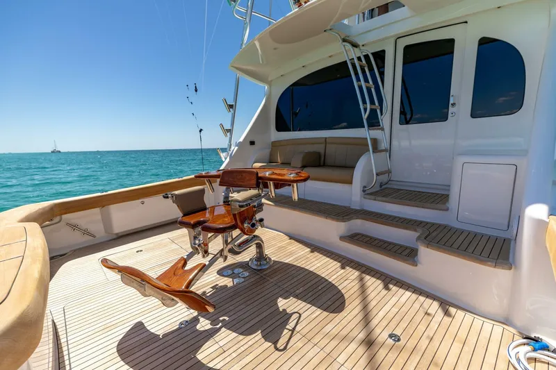 Gas Money Yacht Photos Pics 2015 Viking 62 Convertible yacht deck with fishing chair, ocean view.