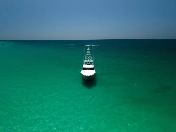 Gas Money Yacht Photos Pics Viking 62 Convertible yacht on turquoise sea, 2015 model.