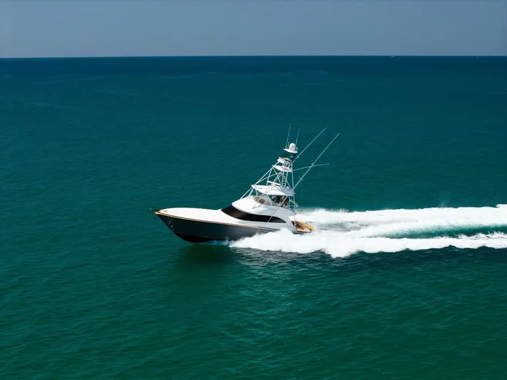 Gas Money Yacht Photos Pics 2015 Viking 62 Convertible yacht cruising on open ocean waters.