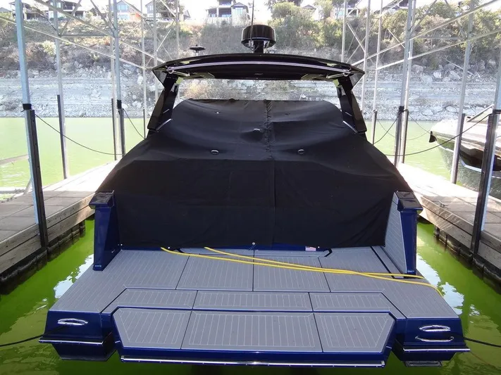  Yacht Photos Pics 2021 Cruisers Yachts 38 GLS I/O docked, covered, with spacious rear deck.