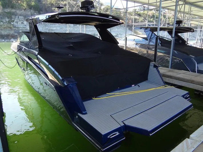  Yacht Photos Pics 2021 Cruisers Yachts 38 GLS I/O docked, covered, in a marina setting.