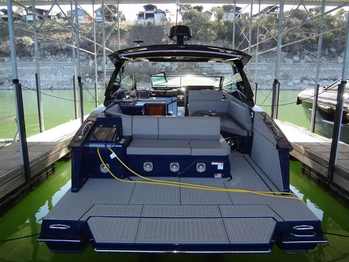  Yacht Photos Pics 2021 Cruisers Yachts 38 GLS I/O docked, showcasing spacious deck and seating area.