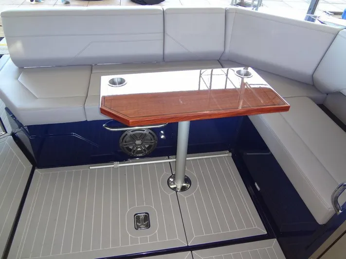  Yacht Photos Pics 2021 Cruisers Yachts 38 GLS I/O interior with seating and wooden table.