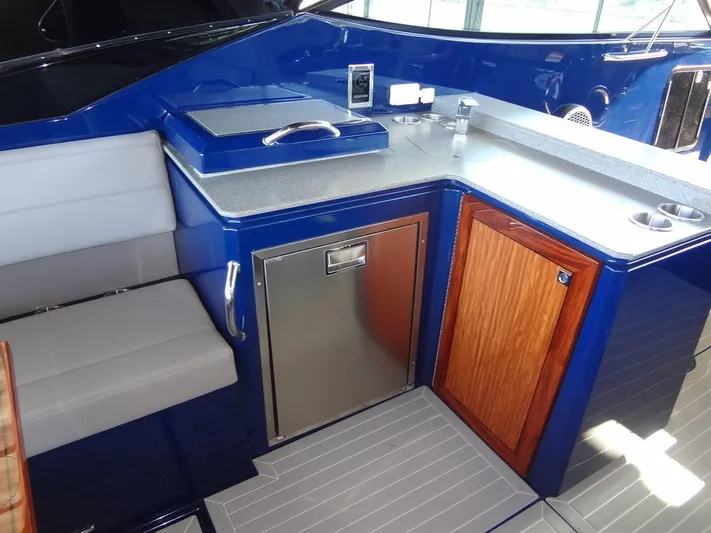  Yacht Photos Pics 2021 Cruisers Yachts 38 GLS I/O interior with kitchenette and seating area.