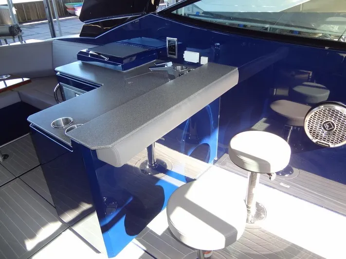  Yacht Photos Pics 2021 Cruisers Yachts 38 GLS I/O interior with sleek bar and seating area.