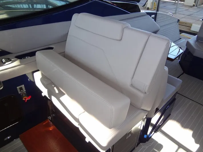  Yacht Photos Pics 2021 Cruisers Yachts 38 GLS I/O interior seating with white upholstery.