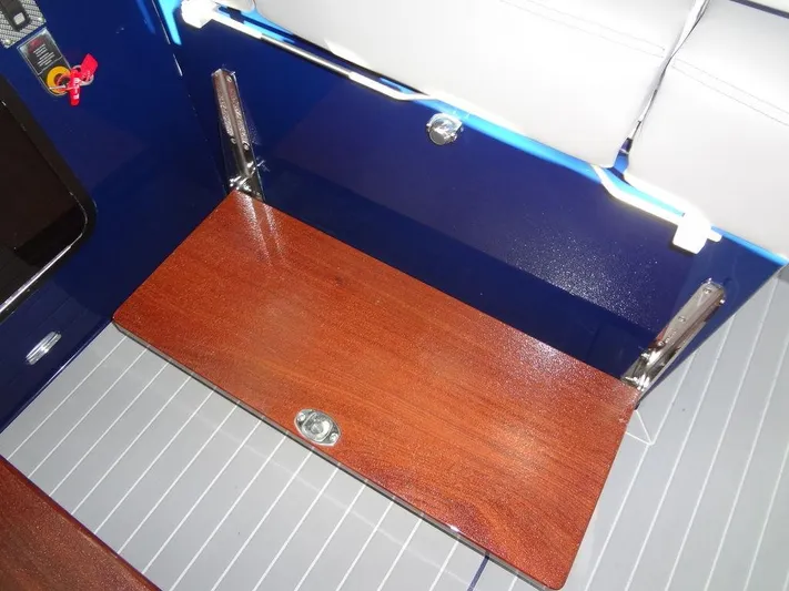  Yacht Photos Pics 2021 Cruisers Yachts 38 GLS I/O interior with wooden fold-out table and seating.