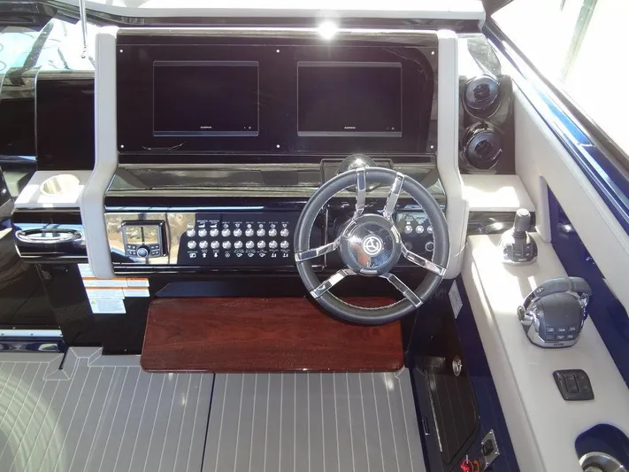  Yacht Photos Pics 2021 Cruisers Yachts 38 GLS I/O helm with dual screens and modern controls.