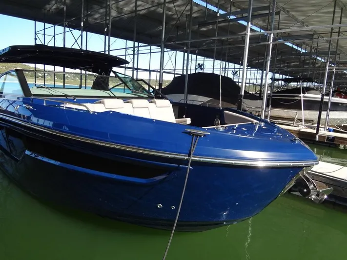  Yacht Photos Pics 2021 Cruisers Yachts 38 GLS I/O in marina, sleek blue design, docked under shelter.