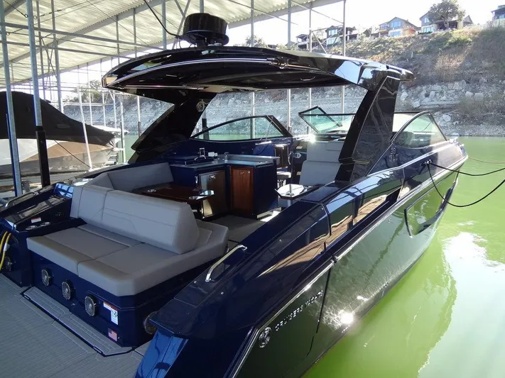  Yacht Photos Pics 2021 Cruisers Yachts 38 GLS I/O in marina, featuring sleek design and spacious seating.