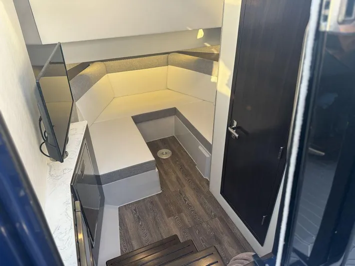  Yacht Photos Pics Interior of 2021 Cruisers Yachts 38 GLS I/O with modern seating and TV.