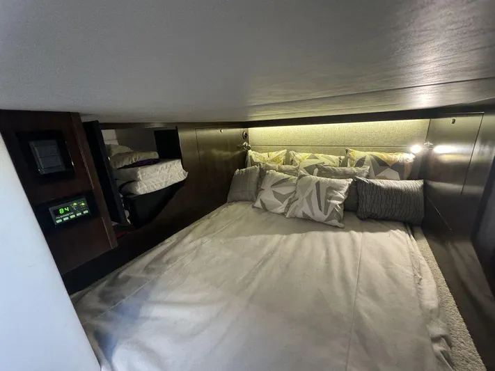  Yacht Photos Pics 2021 Cruisers Yachts 38 GLS I/O cabin interior with cozy bed and ambient lighting.